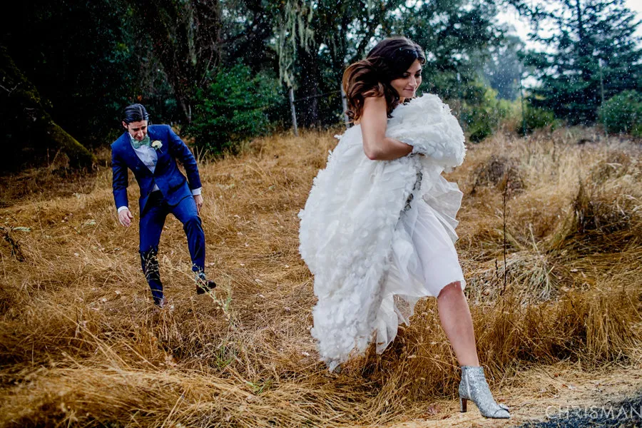 Bride and groom dodge rain